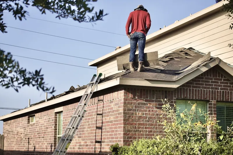 Professional roofer working on a residential roof in Bushkill